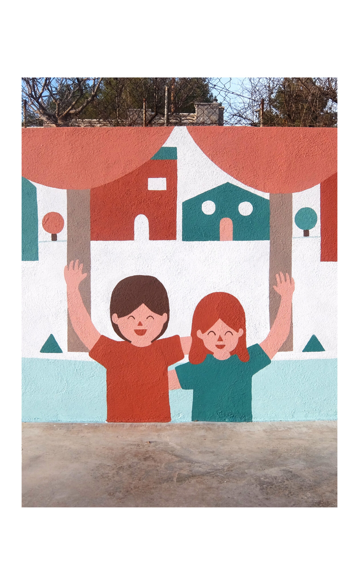Colorful mural of smiling children with raised arms