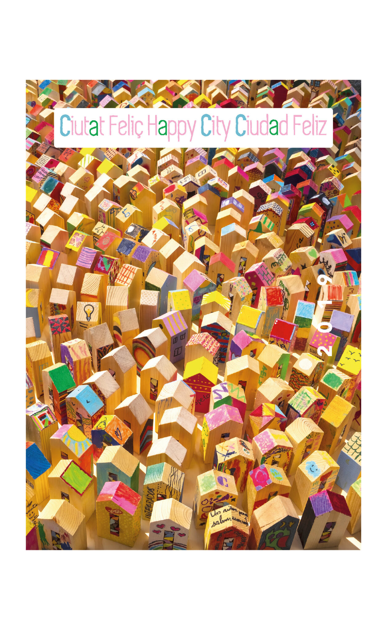 Colorful miniature wooden houses forming vibrant happy city