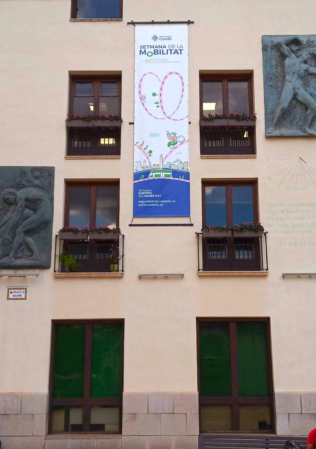Building facade with mobility week banner and windows