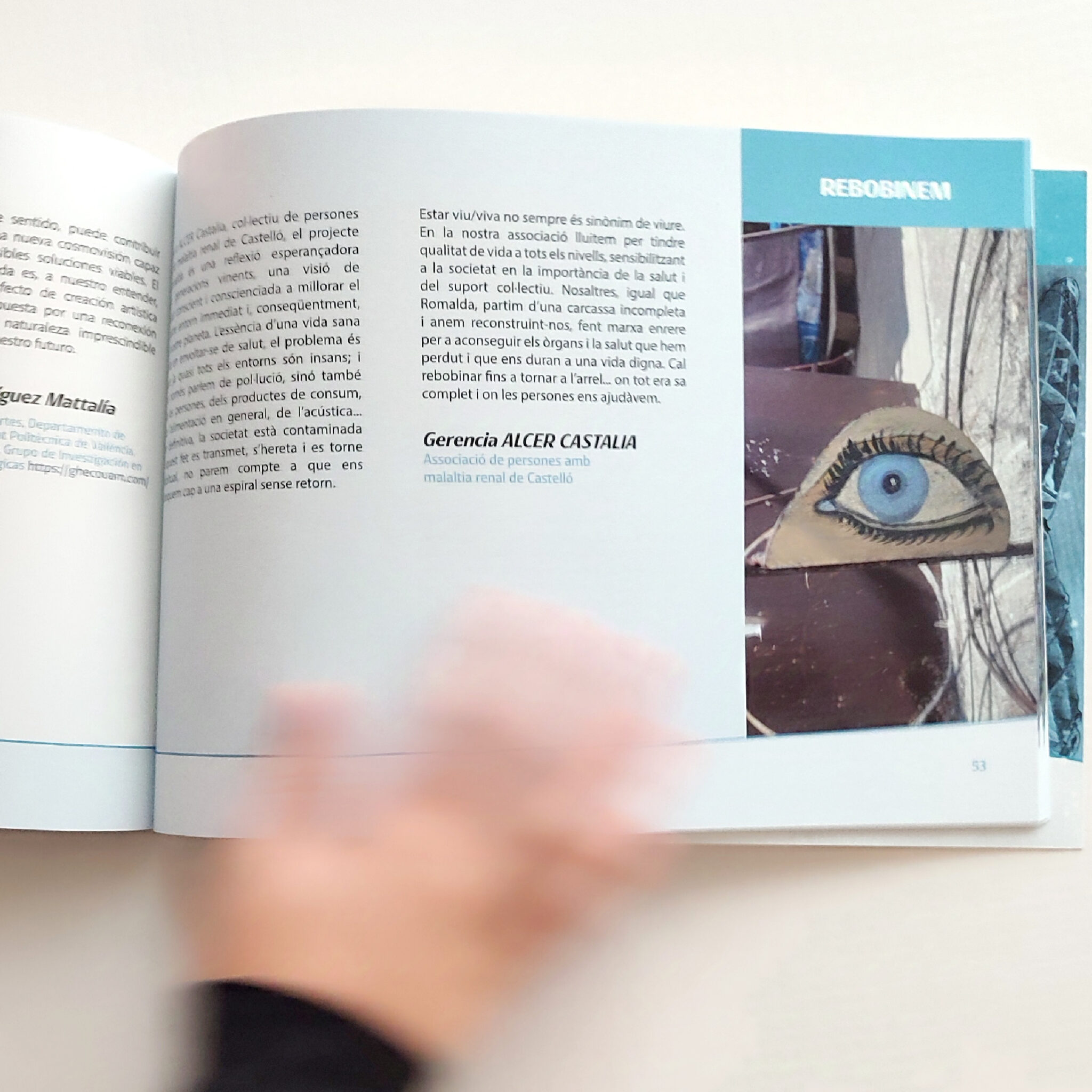 Open book with painted eye artwork photo